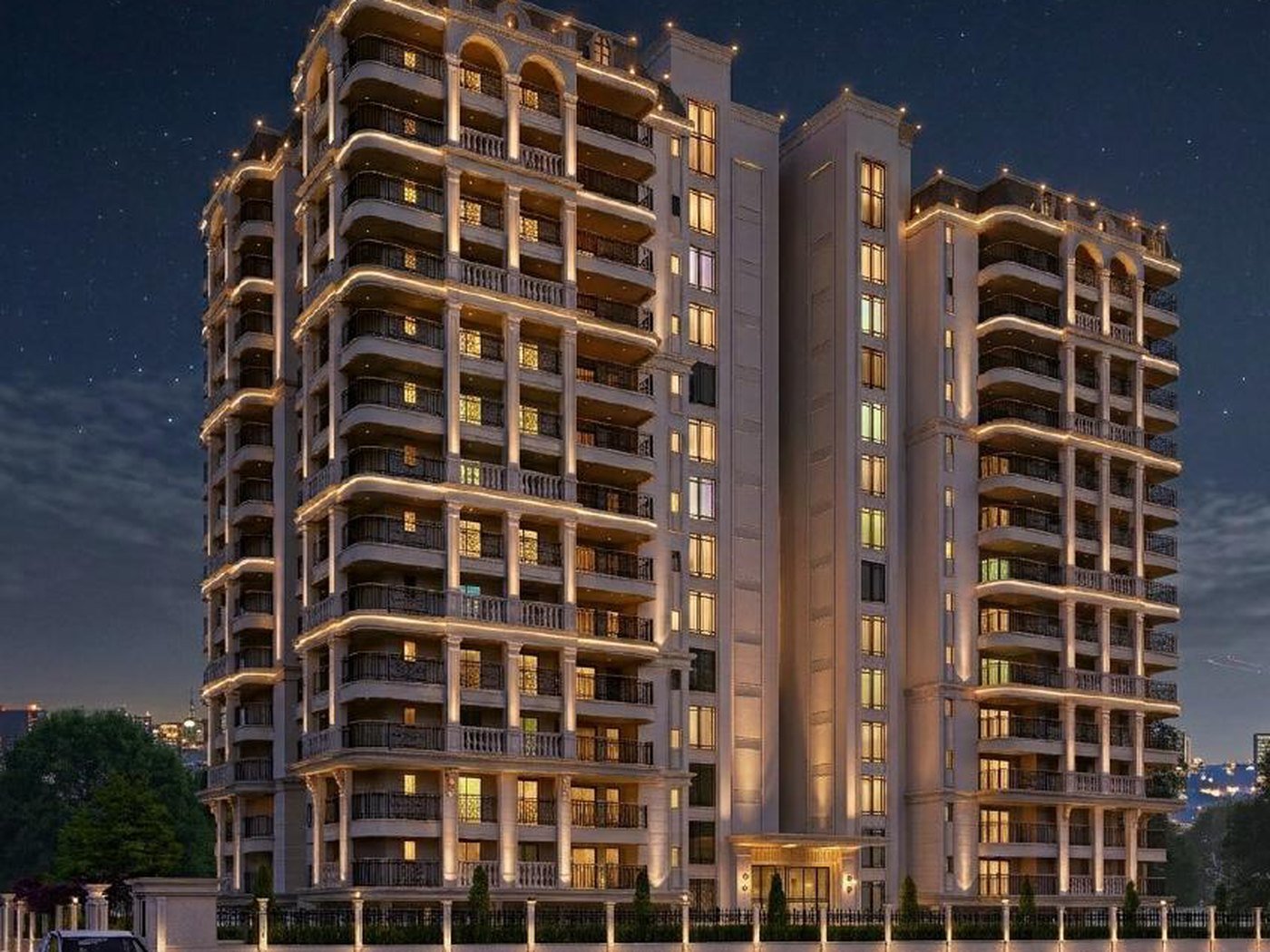 Artistic impression of the Rohit Avenue tower lit at night, with the entrance lobby and landscaped forecourt